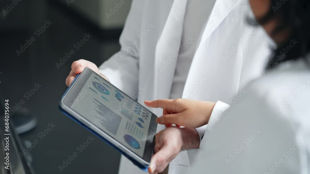 Poster group of researchers looking at tablet data in the lab. research and development.