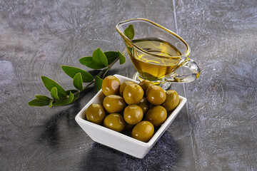 Ripe tasty green olives with branch
