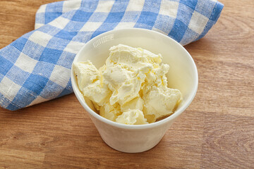 Italian soft mascarpone cheese in the bowl