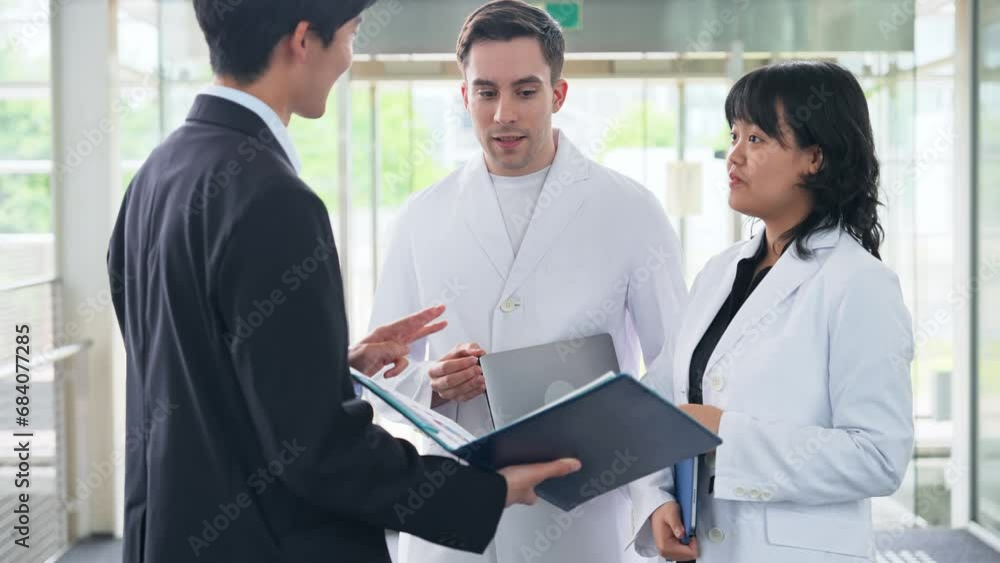 Poster a multinational group having a conversation in the lobby. people in white coats and sales staff. hig