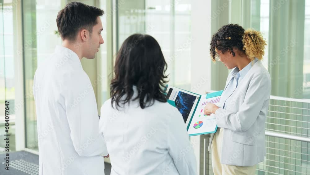 Poster a multinational group having a conversation in the lobby. people in white coats and sales staff. hig