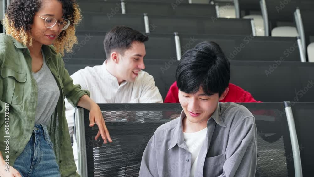 Poster group of multinational students having a conversation in a classroom.