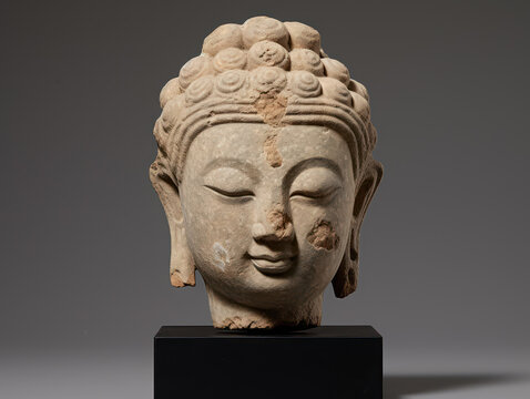 a photo art of a Buddha statue with distinctive carvings placed in a museum