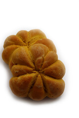 Bright orange pumpkin shaped bread buns isolated on white background