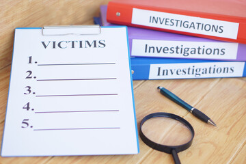 Investigation folders and victims list paper notepad clipboard. Magnifying glass and pen. Concept,...