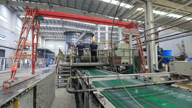 Workers work nervously on the production line of new building materials calcium silicate board, North China
