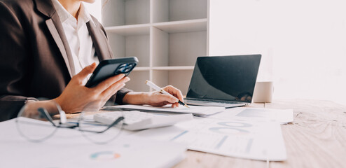 Intelligence analysis concept, group of business people brainstorm discussing current finance and economy on company investment laptop at meeting