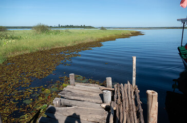 wooden bridge into the lake