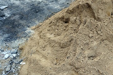  A pile of sand on cement floor at construction site with copy space.