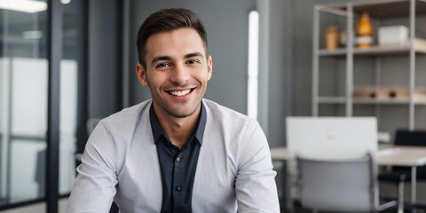 Successful male entrepreneur smiling at the camera. Professional business background with copy space.