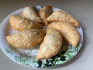 Gujiya or gujia or karanji - sweet dumplings. Indian snack made on diwali, holi and for...