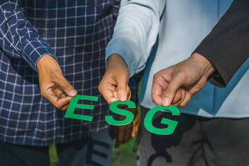 ESG concept ,Sustainable teamwork and partnership Hands  Shoe ESG word Ideas for Sustainable...
