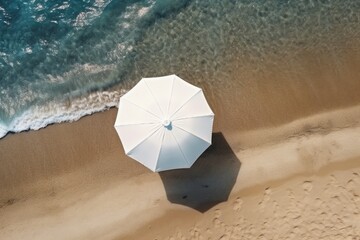 Aerial view of sandy beach with umbrella and blue water. Generative AI