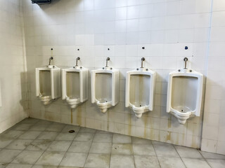 Vespasiano row of urinals on the wall of a stadium