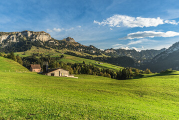 Fototapeta na wymiar Appenzellerland, landscape with farms and green meadows, view of Hoher Kasten and Kamor in the Alpstein mountains, Bruelisau, Canton Appenzell Innerrhoden, Switzerland