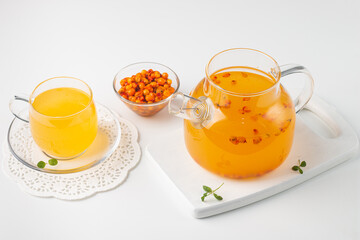 Sea buckthorn tea drink with oranges and mint. Autumn comfort hot drink. Herbal vitamin tea. 