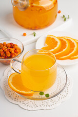 Sea buckthorn tea drink with oranges and mint. Autumn comfort hot drink. Herbal vitamin tea. 