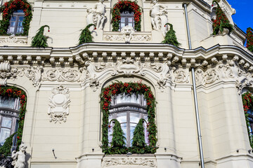 Beautiful white window decorated for Christmas on an art nouveau building in the city center of...