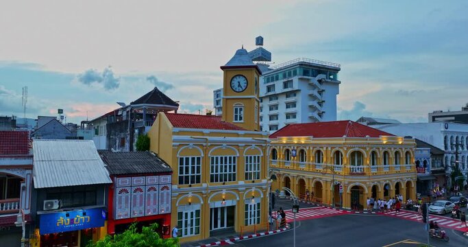 .Phuket,Thailand-April,19,2023: An aerial view of Phuket's most popular historical landmarks..clock tower the classic and beautiful architecture at Charter intersection. .popular landmark in Phuket.