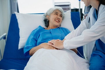  Caucasian doctor smiling take care of a young patient in hospital. Friendly nurse or therapeutic...