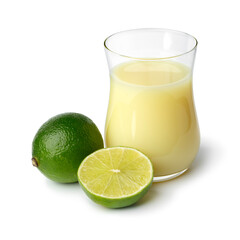 Glass with lime juice and green lime in front isolated on white background