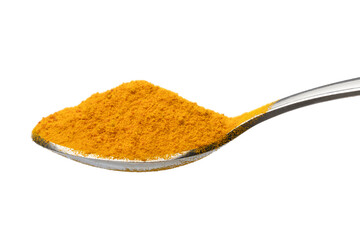 Metal spoon with Turmeric, Curcuma longa ground  powder close up on white background