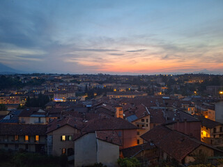 View of a small town at sunset, a beautiful contrast between the houses and the landscape