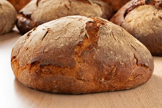 Traditional German sourdough loaf of bread with a crunchy crust in the bakery close up 