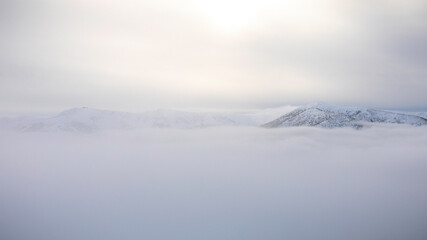 fog over the mountains in winter