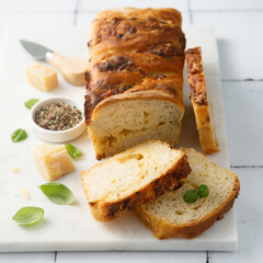 Homemade cheese bread with fresh basil
