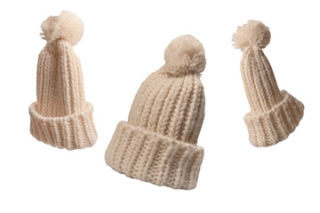 Beige beanie hat with pom pom isolated on a white background.