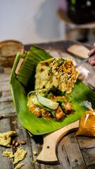 pecel rice as traditional food in Indonesia with tasty and spicy sambal captured with high quality camera.