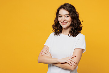 Side view young cheerful Caucasian woman she wear white blank t-shirt casual clothes hold hands...