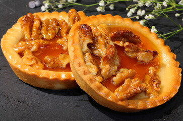 baked cupcakes with sugared and caramelized walnuts