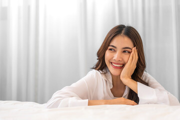 Portrait of smiling beautiful pretty asian woman clean fresh healthy white skin posing smile in pajamas white clothes, skincare, lady, model, cosmetic, fashion.Girl relax, enjoy at home.asia beauty