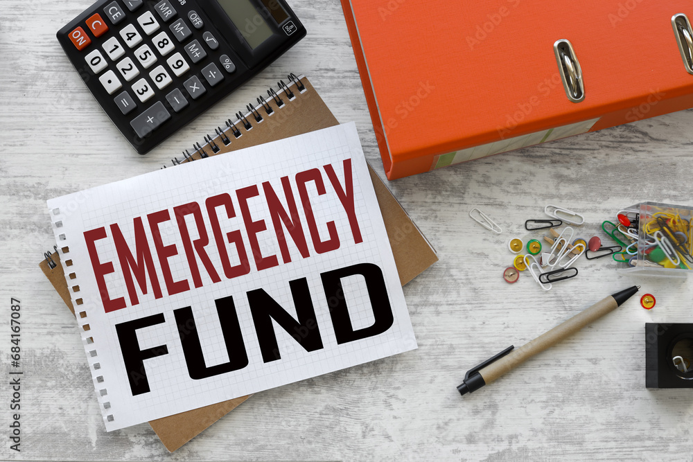 Poster emergency fund notepad page with text. on a yellow notepad