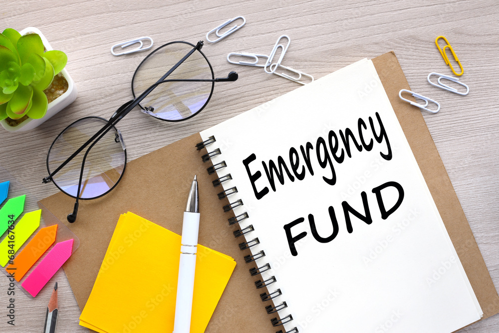 Poster emergency fund, open notepad with text. bright stickers point to text