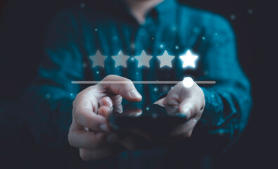 Client holding smartphone to review feedback to give five stars rating for customer evaluation and...