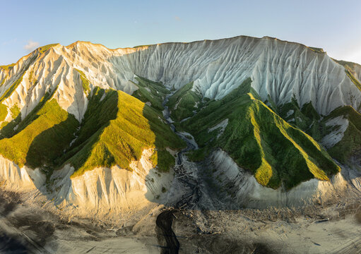 Russia, Kuril Islands, Iturup Island, White rocks on the coast of the Sea of Okhotsk. Aerial view.