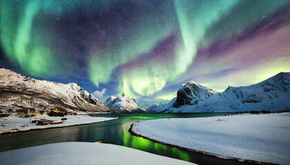 northern lights aurora borealis in the sky over snow covered mountains range and river fantastic nature scenery wonderful winter landscape lofoten islands norway christmas travelling concept