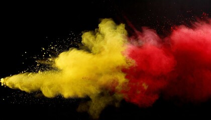 red and yellow colored powder explosions on black background holi paint powder splash in colors of spanish flag