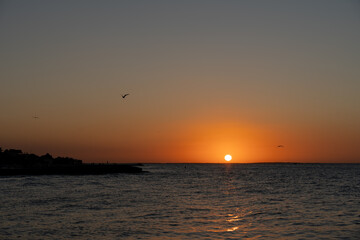 Fototapeta na wymiar Beautiful sunset over the sea from Holbox, Mexico