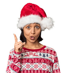 Young Hispanic in Christmas attire with hat smiling cheerful showing number five with fingers.