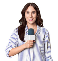 Young Caucasian journalist with microphone in studio setting