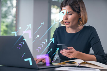 Pensive attractive beautiful businesswoman in formal wear working on laptop at office workplace in...