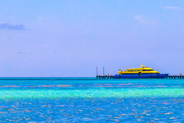 Boats yachts ship catamaran jetty beach Playa del Carmen Mexico.