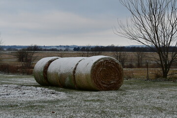 Snow on Hay Bales in a Farm Field