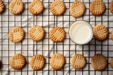 Fresh baked classic peanut butter cookies  with milk glass. Criss cross patterned biscuits. American breakfast. Sugar-free flourless cookies