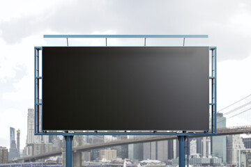 Fototapeta premium Blank black horizontal billboard on skyline background, front view. Mock up, advertising concept