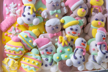 Fototapeta na wymiar Christmas marshmallows. Winter candy. Sweet food in december. Snowman and Santa Claus